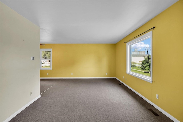203 E Wilson, Tuscola, IL 61953 - spare room with dark colored carpet and baseboards
