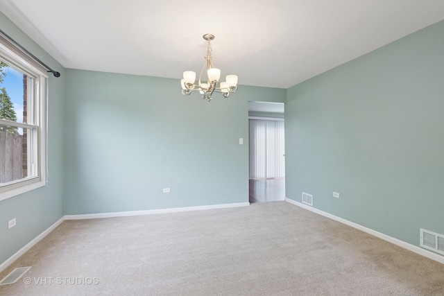 12809 W Meadowview Ln, Homer Glen, IL 60491 - carpeted empty room featuring a chandelier and baseboards