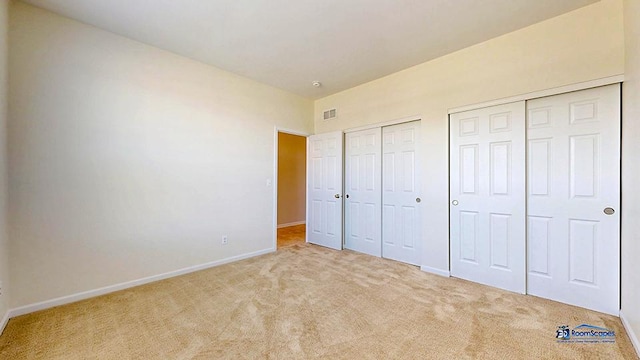 2215 Truman Trl, Mchenry, IL 60051 - unfurnished bedroom with carpet floors and multiple closets