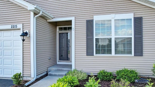 2215 Truman Trl, Mchenry, IL 60051 - doorway to property with an attached garage