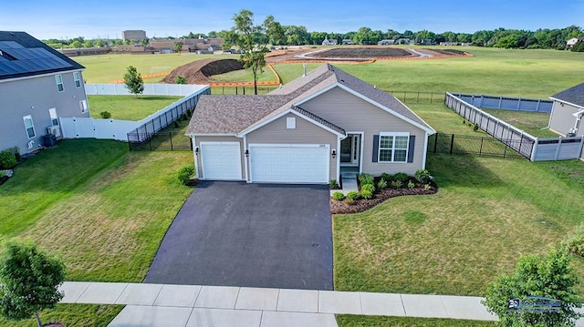 2215 Truman Trl, Mchenry, IL 60051 - view of front of property with a fenced backyard, asphalt driveway, and a garage