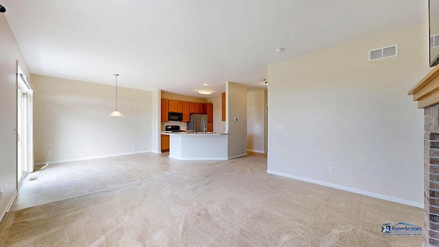 2215 Truman Trl, Mchenry, IL 60051 - unfurnished living room with light carpet and a fireplace