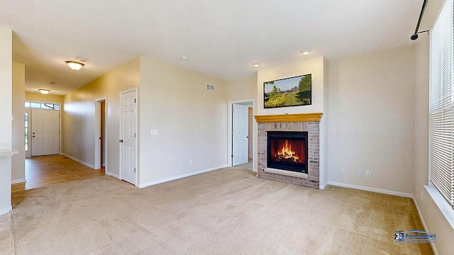 2215 Truman Trl, Mchenry, IL 60051 - unfurnished living room featuring carpet floors and a brick fireplace