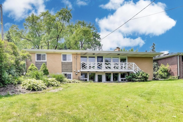 141 S Cedar St, Palatine, IL 60067 - back of property with a yard, a chimney, and a wooden deck