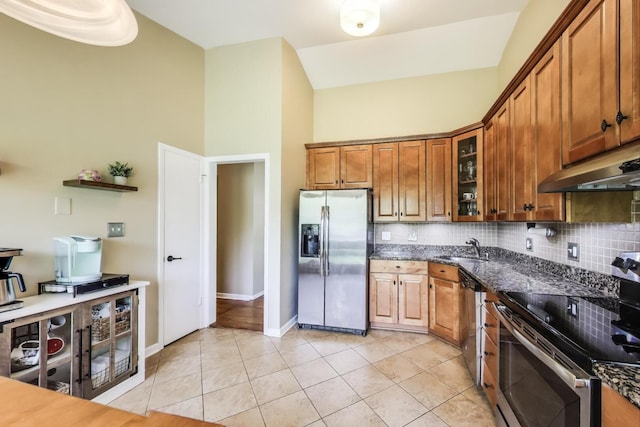 141 S Cedar St, Palatine, IL 60067 - kitchen with stainless steel appliances, brown cabinets, backsplash, a towering ceiling, and under cabinet range hood