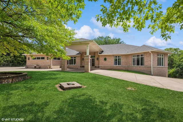 26 Red Hawk Dr, Oswego, IL 60543 - view of front facade featuring brick siding, a front yard, a patio, and roof with shingles