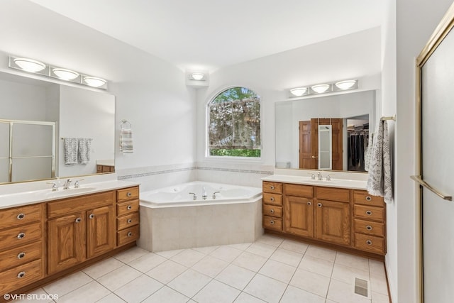 26 Red Hawk Dr, Oswego, IL 60543 - full bath with two vanities, tile patterned flooring, a shower stall, a bath, and a closet