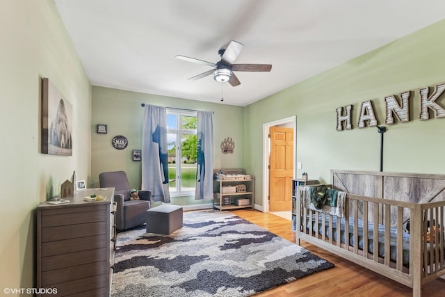 26 Red Hawk Dr, Oswego, IL 60543 - bedroom with wood finished floors and a ceiling fan
