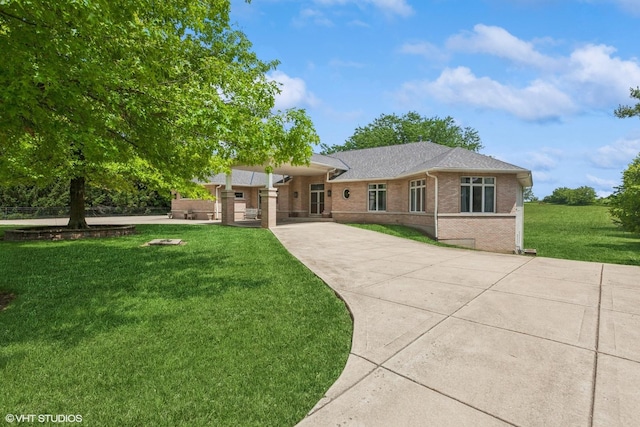 26 Red Hawk Dr, Oswego, IL 60543 - ranch-style house with brick siding, a front lawn, and a shingled roof