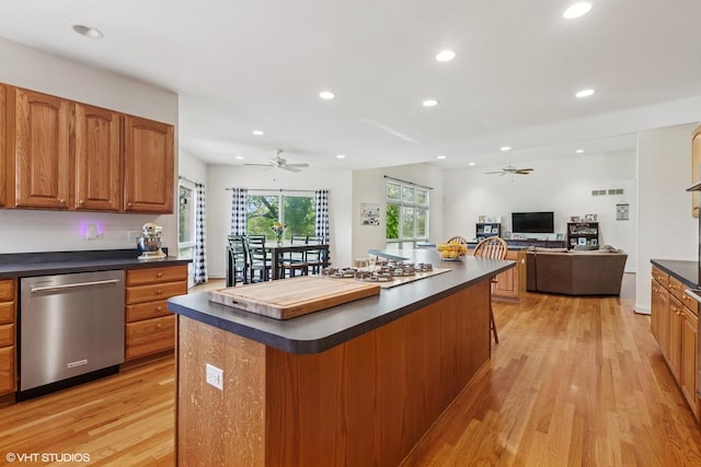 26 Red Hawk Dr, Oswego, IL 60543 - kitchen with stainless steel dishwasher, a ceiling fan, dark countertops, light wood-type flooring, and recessed lighting