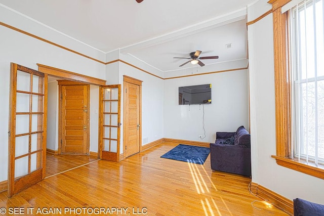 5942 S Calumet Ave, Chicago, IL 60637 - unfurnished room featuring a ceiling fan, wood finished floors, crown molding, and french doors