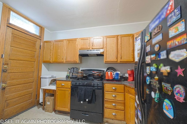 5942 S Calumet Ave, Chicago, IL 60637 - kitchen featuring black appliances, under cabinet range hood, ornamental molding, dark countertops, and brown cabinets