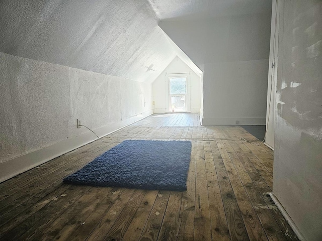611 S Dixon Ave, Dixon, IL 61021 - bonus room with hardwood / wood-style flooring, lofted ceiling, and a textured wall