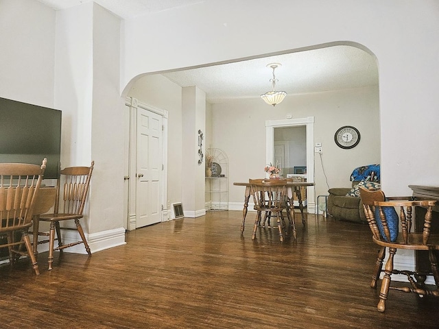 611 S Dixon Ave, Dixon, IL 61021 - dining room with arched walkways and wood finished floors