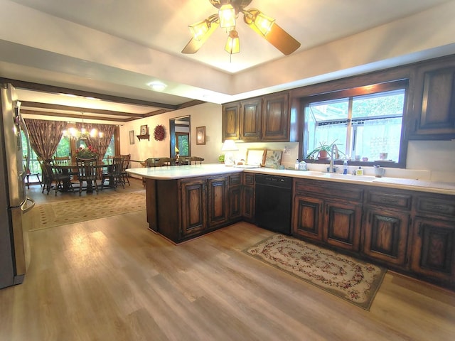 28442 W Main St, Barrington, IL 60010 - kitchen with dishwasher, a peninsula, light countertops, light wood-style flooring, and a chandelier