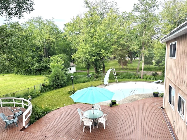28442 W Main St, Barrington, IL 60010 - view of pool featuring a deck, a fenced backyard, outdoor dining area, and view of wooded area