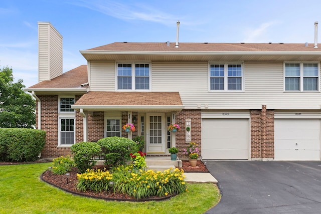 16026 85th Pl, Tinley Park, IL 60487 - view of front of home featuring driveway, brick siding, a chimney, a garage, and roof with shingles