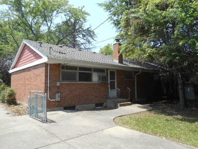 219 N Wilke Rd, Arlington Heights, IL 60005 - ranch-style home with a chimney and brick siding