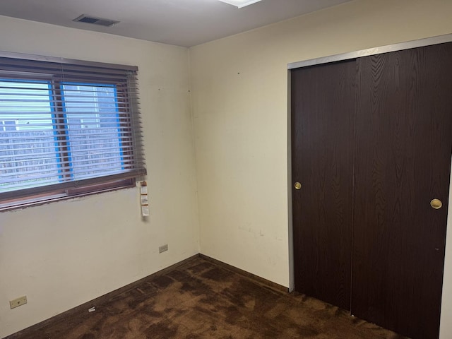 662 Berwick Pl, Roselle, IL 60172 - spare room featuring dark carpet