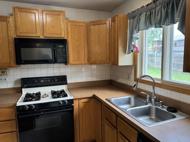 662 Berwick Pl, Roselle, IL 60172 - kitchen with black appliances, decorative backsplash, and light countertops