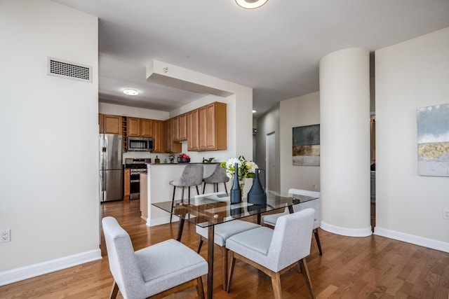 233 E 13th St Unit 2001, Chicago, IL 60605 - dining room with light wood finished floors and baseboards