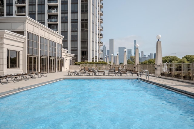 233 E 13th St Unit 2001, Chicago, IL 60605 - community pool featuring a patio and a skyline view