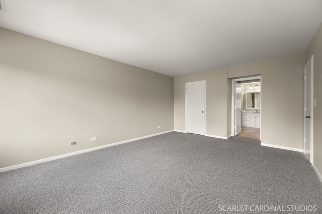 190 S Wood Dale Rd Unit 406, Wood Dale, IL 60191 - unfurnished bedroom with dark colored carpet and connected bathroom