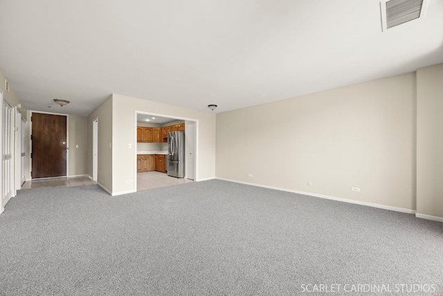 190 S Wood Dale Rd Unit 406, Wood Dale, IL 60191 - unfurnished living room with baseboards and light colored carpet