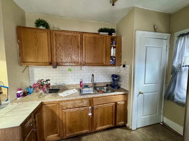 109 Seminary Ave, Aurora, IL 60505 - kitchen with decorative backsplash, brown cabinets, light countertops, light tile patterned floors, and open shelves