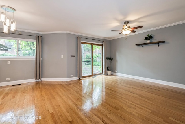 806 S May St, Chicago, IL 60607 - empty room featuring plenty of natural light, light wood-style flooring, a ceiling fan, and ornamental molding