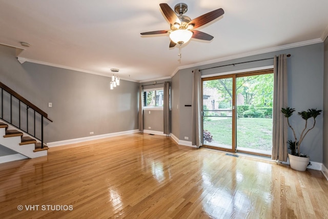 806 S May St, Chicago, IL 60607 - unfurnished living room featuring crown molding, light wood-style floors, stairs, and a ceiling fan