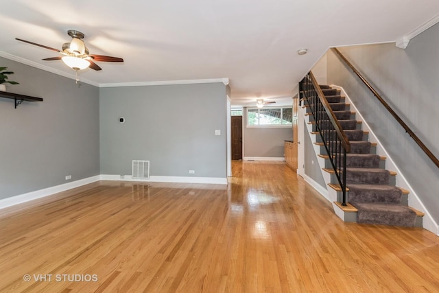 806 S May St, Chicago, IL 60607 - unfurnished living room featuring stairs, ceiling fan, crown molding, and light wood-style flooring