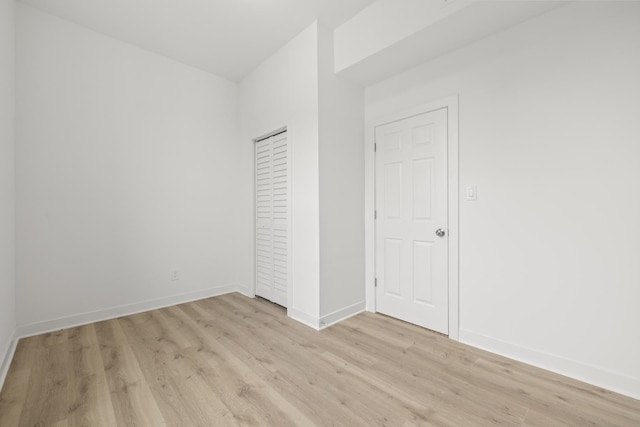 1532 S Homan Ave, Chicago, IL 60623 - unfurnished bedroom with light wood finished floors and a closet