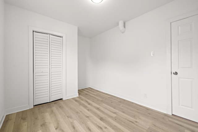 1532 S Homan Ave, Chicago, IL 60623 - unfurnished bedroom with light wood finished floors and a closet
