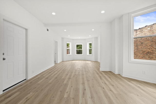 1532 S Homan Ave, Chicago, IL 60623 - unfurnished living room featuring light wood-style floors and recessed lighting