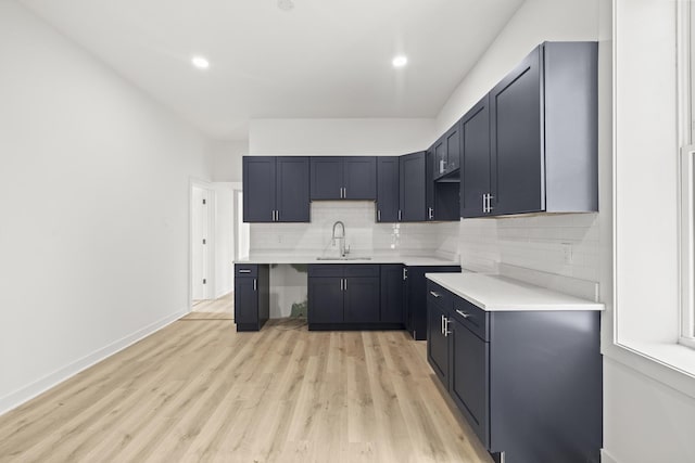 1532 S Homan Ave, Chicago, IL 60623 - kitchen featuring backsplash, light wood-type flooring, light countertops, and recessed lighting