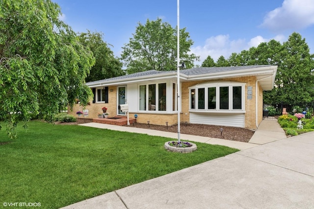 200 E Park Ave, Bloomingdale, IL 60108 - view of front facade featuring brick siding and a front lawn