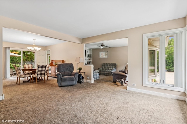 200 E Park Ave, Bloomingdale, IL 60108 - carpeted living area featuring a chandelier and a ceiling fan