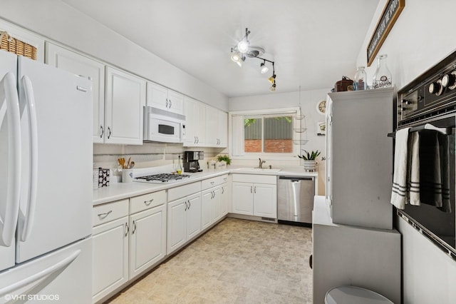 200 E Park Ave, Bloomingdale, IL 60108 - kitchen with white appliances, white cabinetry, light countertops, and light floors