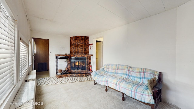 3120 N Natoma Ave, Chicago, IL 60634 - carpeted living room with radiator heating unit and a brick fireplace
