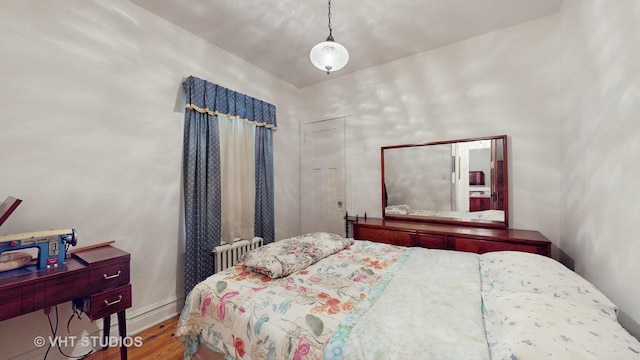 3120 N Natoma Ave, Chicago, IL 60634 - bedroom featuring wood finished floors and radiator