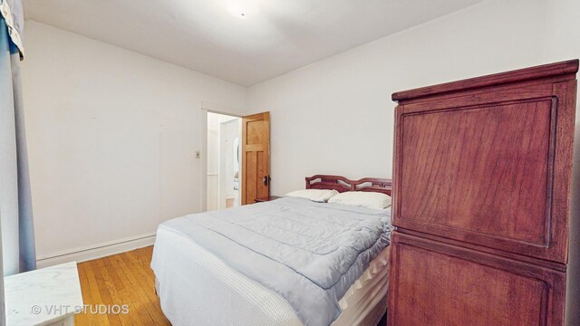 3120 N Natoma Ave, Chicago, IL 60634 - bedroom featuring light wood-style flooring and baseboards