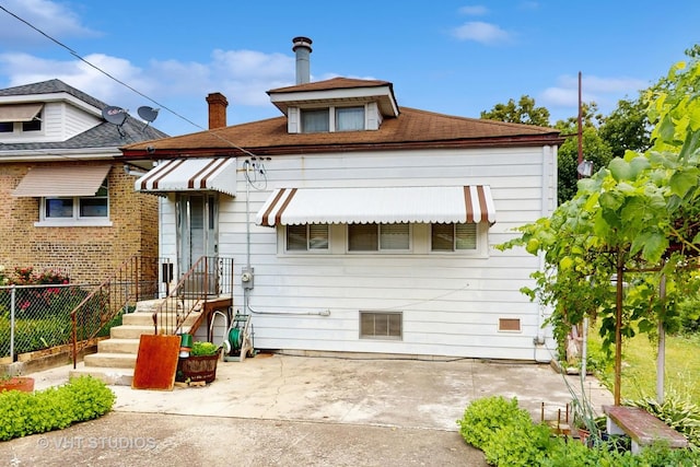 3120 N Natoma Ave, Chicago, IL 60634 - view of front of house featuring a patio and a chimney