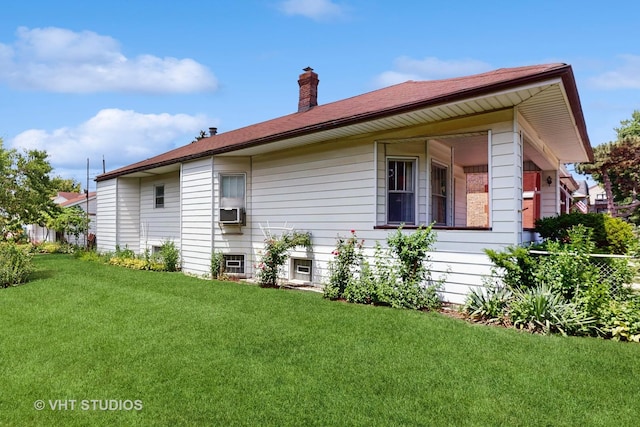 3120 N Natoma Ave, Chicago, IL 60634 - view of side of property with a lawn, a chimney, and cooling unit