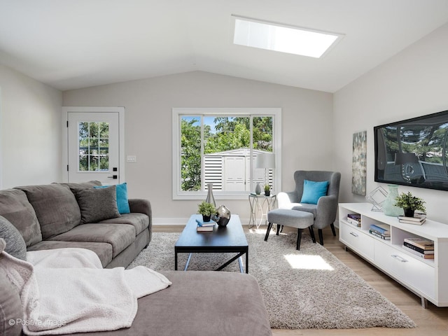 622 Pleasant Pl, Streamwood, IL 60107 - living room with light wood-type flooring and vaulted ceiling