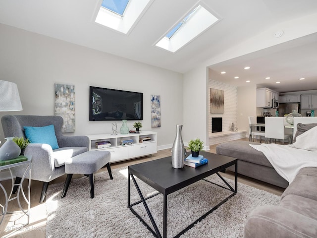 622 Pleasant Pl, Streamwood, IL 60107 - living area with lofted ceiling, light wood-type flooring, recessed lighting, a skylight, and a fireplace