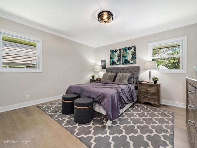 622 Pleasant Pl, Streamwood, IL 60107 - bedroom with wood finished floors and ornamental molding