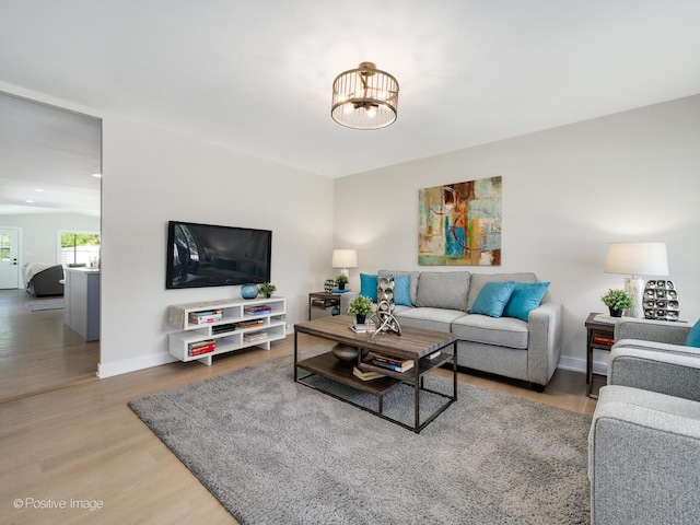 622 Pleasant Pl, Streamwood, IL 60107 - living area featuring wood finished floors and a chandelier