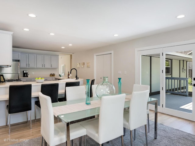 622 Pleasant Pl, Streamwood, IL 60107 - dining space featuring light wood finished floors and recessed lighting