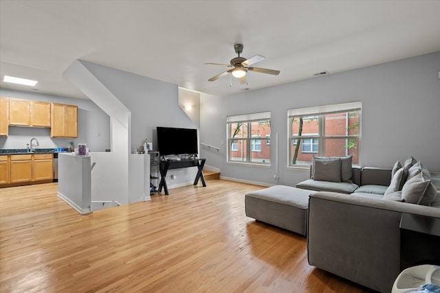 4518 S Woodlawn Ave Unit 4518, Chicago, IL 60653 - living room with ceiling fan and light wood-style floors